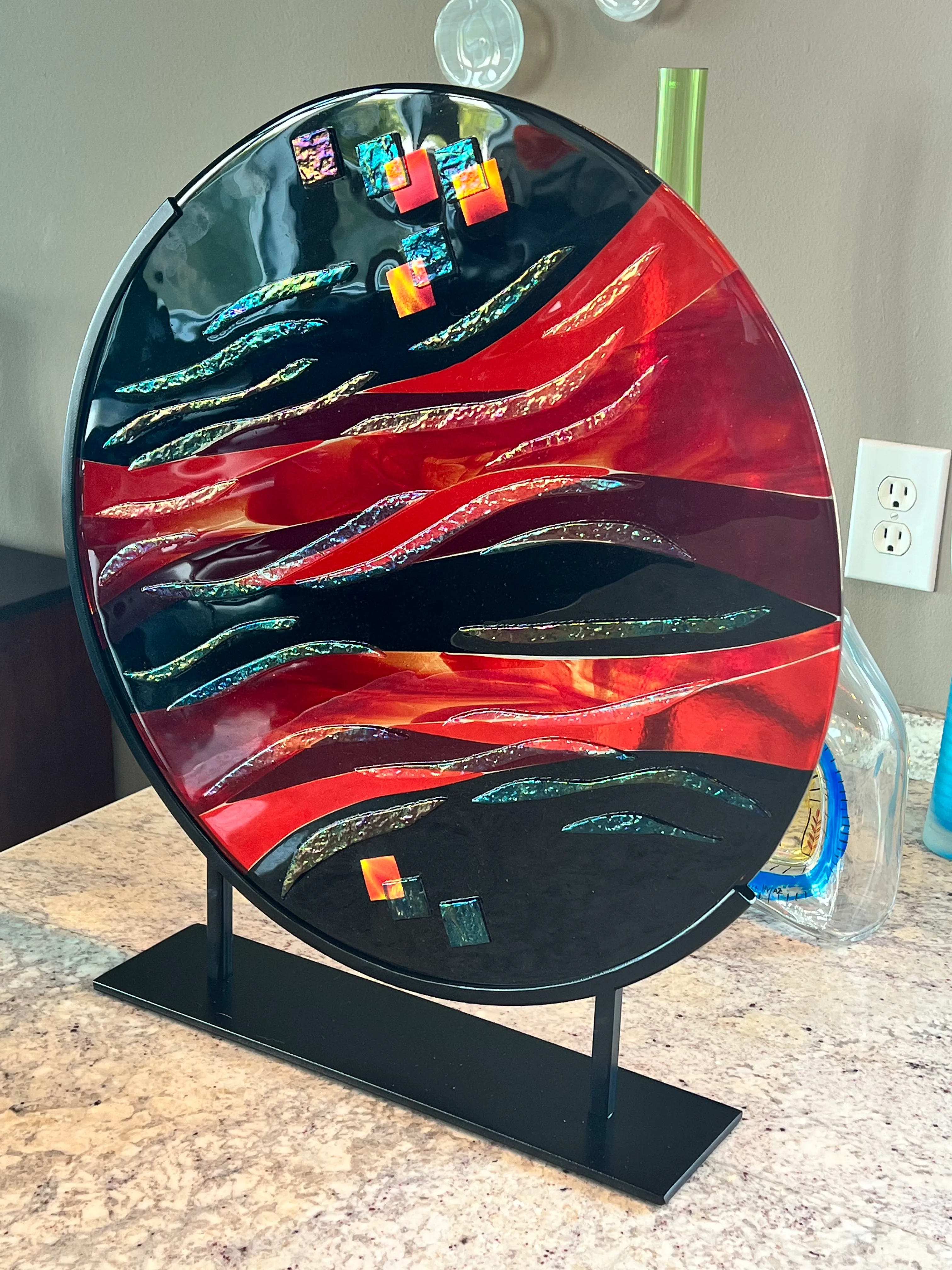 Vibrant glass sculpture with layered colors