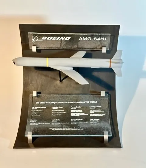 Collaborative metal and glass art piece with vibrant color