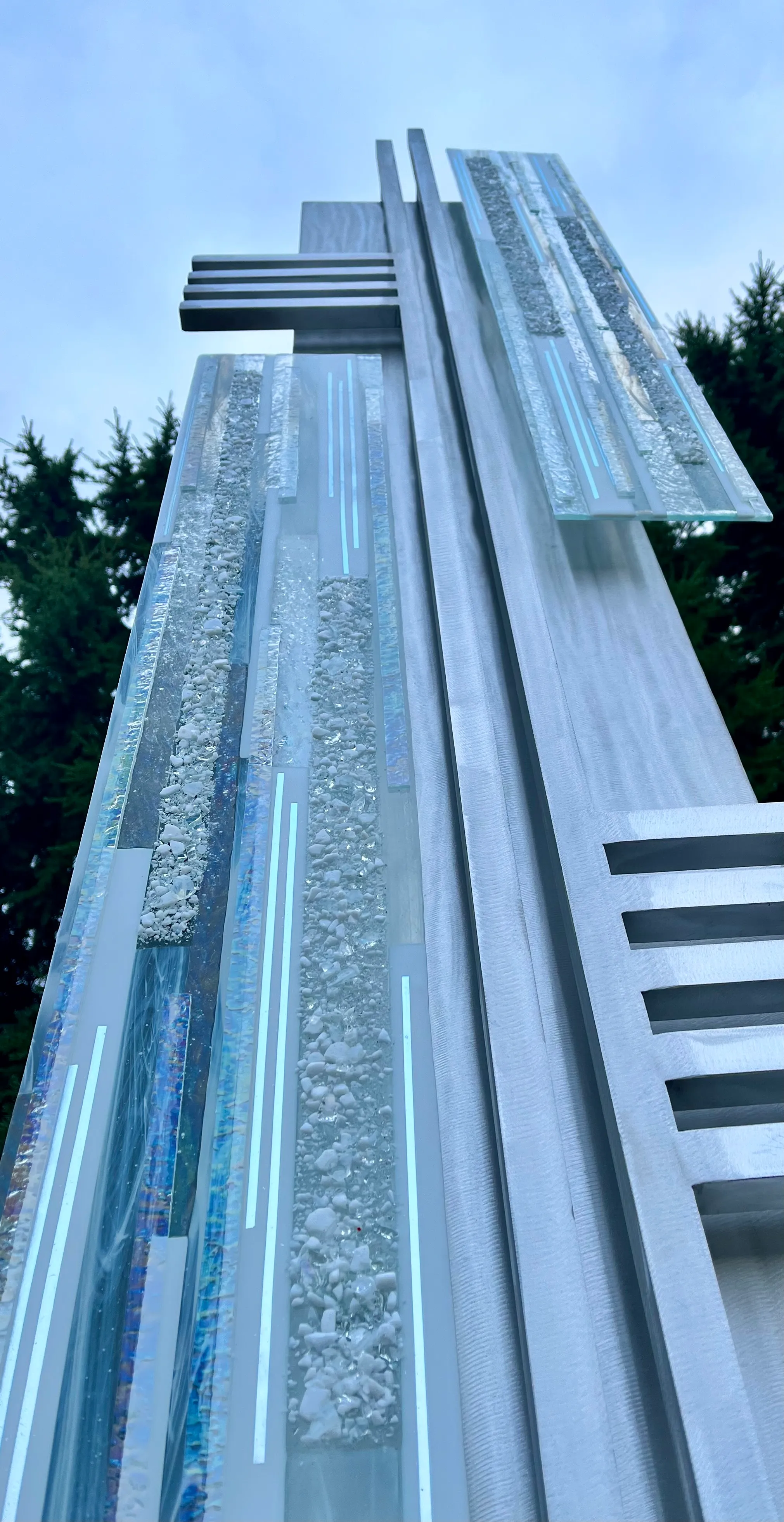 Metal framework with kiln-fired glass elements