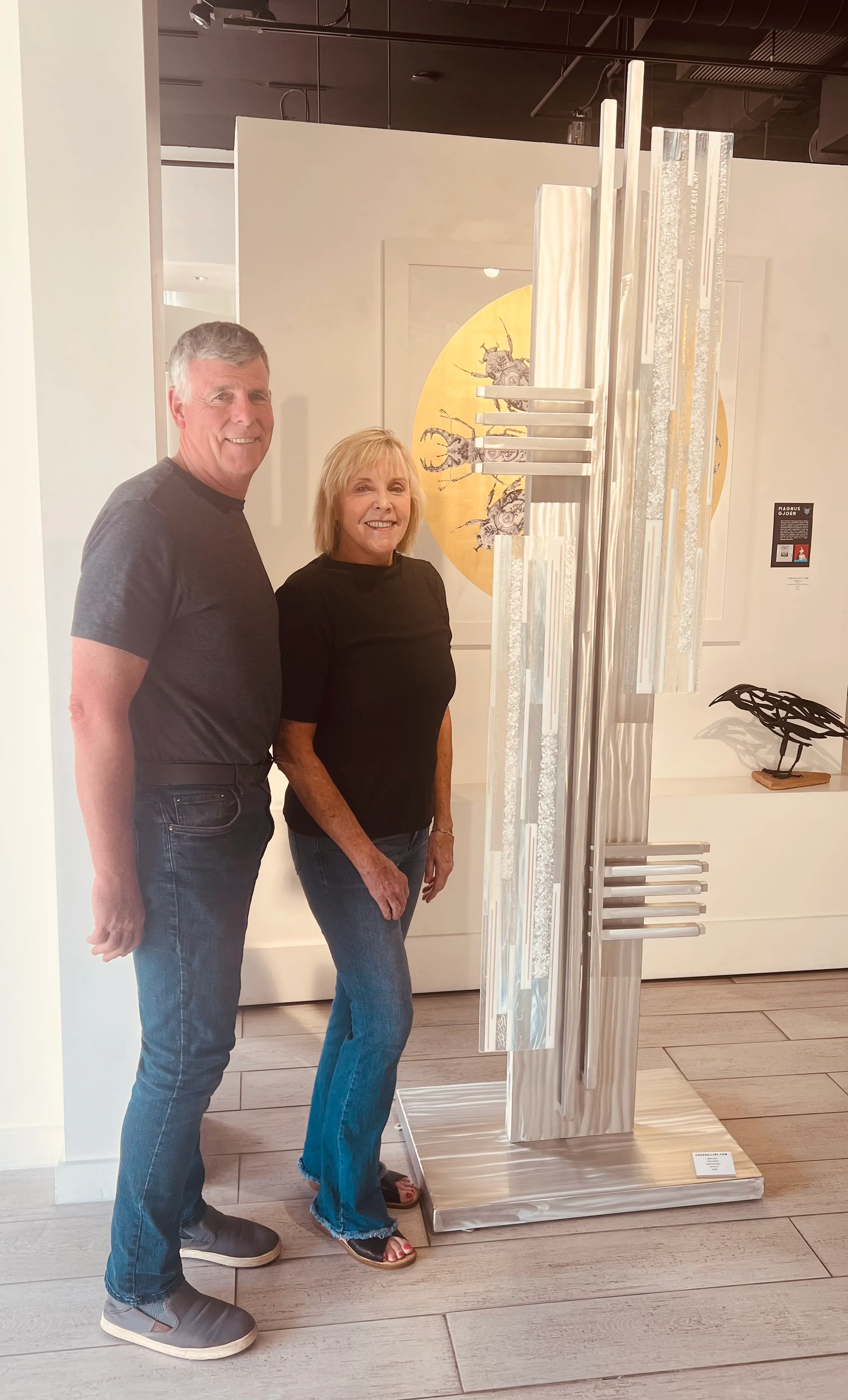 Collaborative sculpture blending metal strength and glass transparency