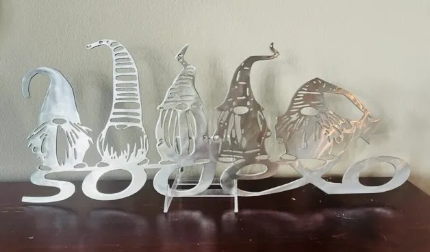 Hand-cut metal sign with decorative elements