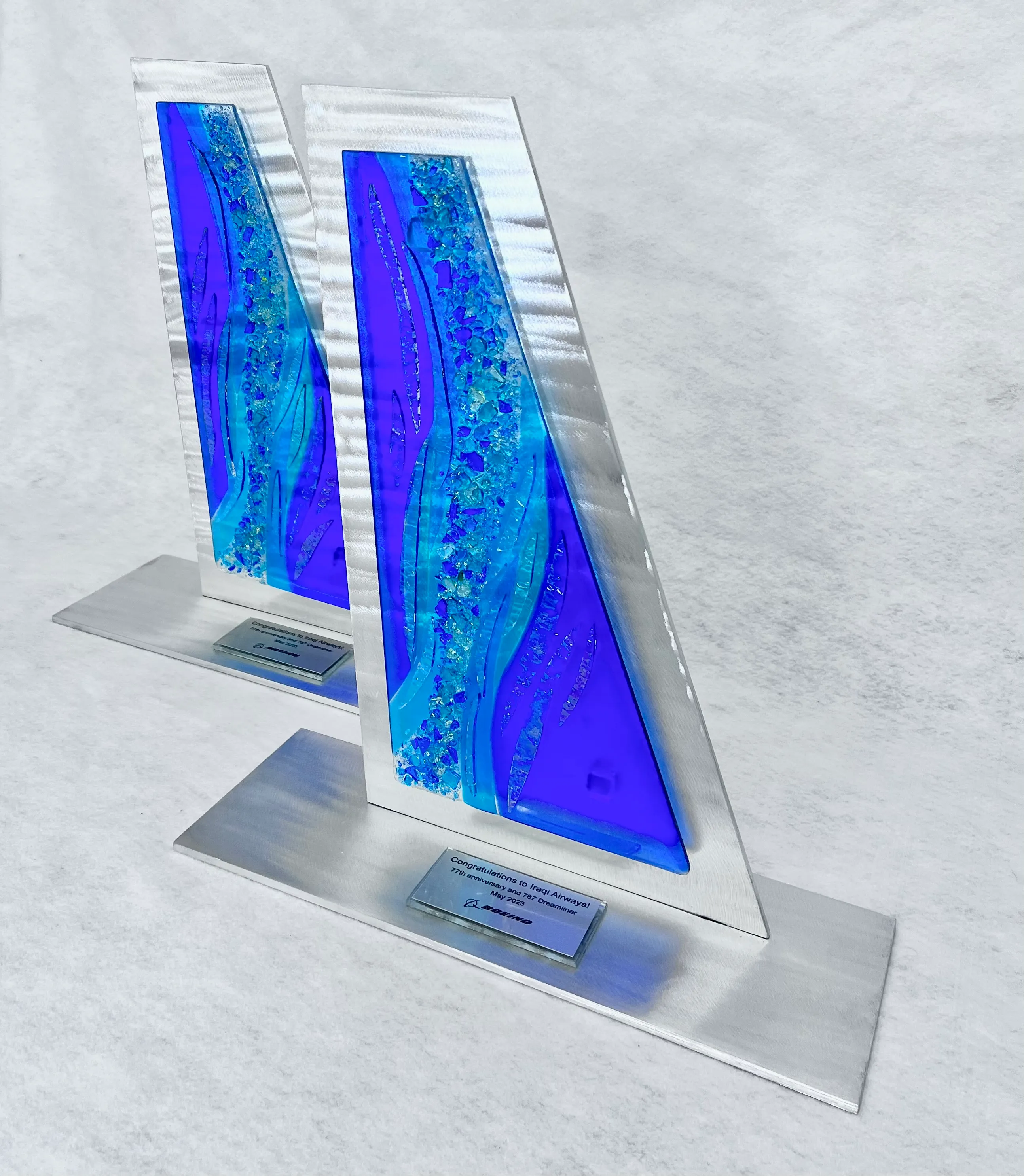 Welded steel sculpture with integrated glass panels