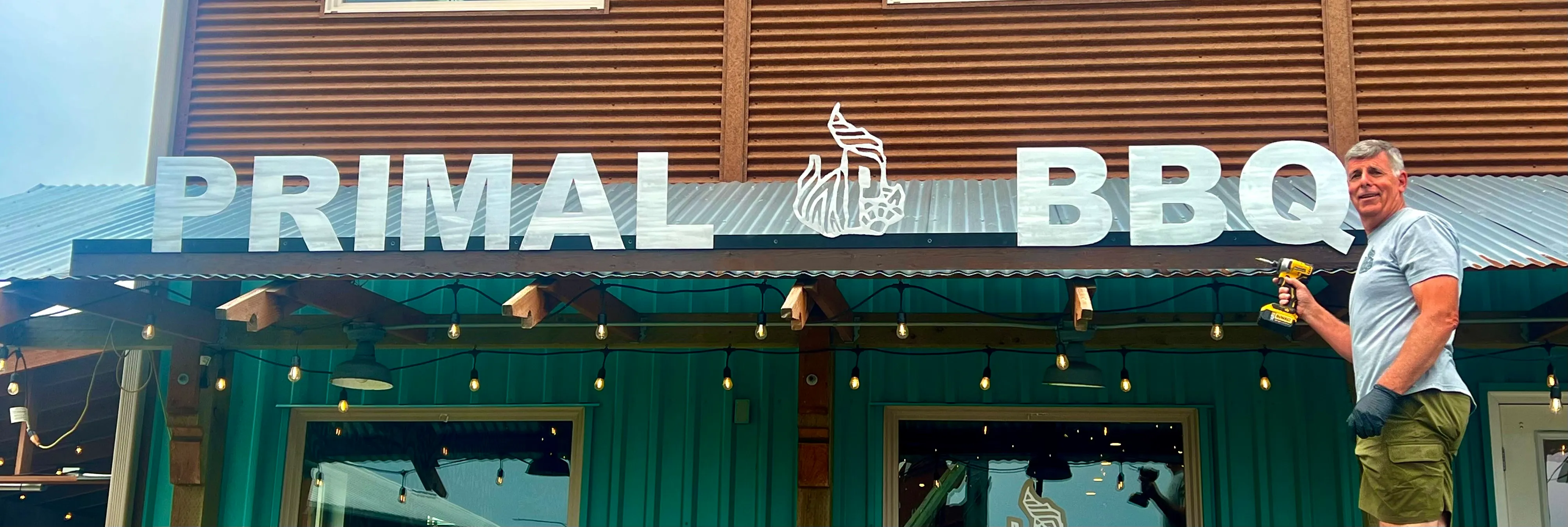 Metal business sign with artistic finish