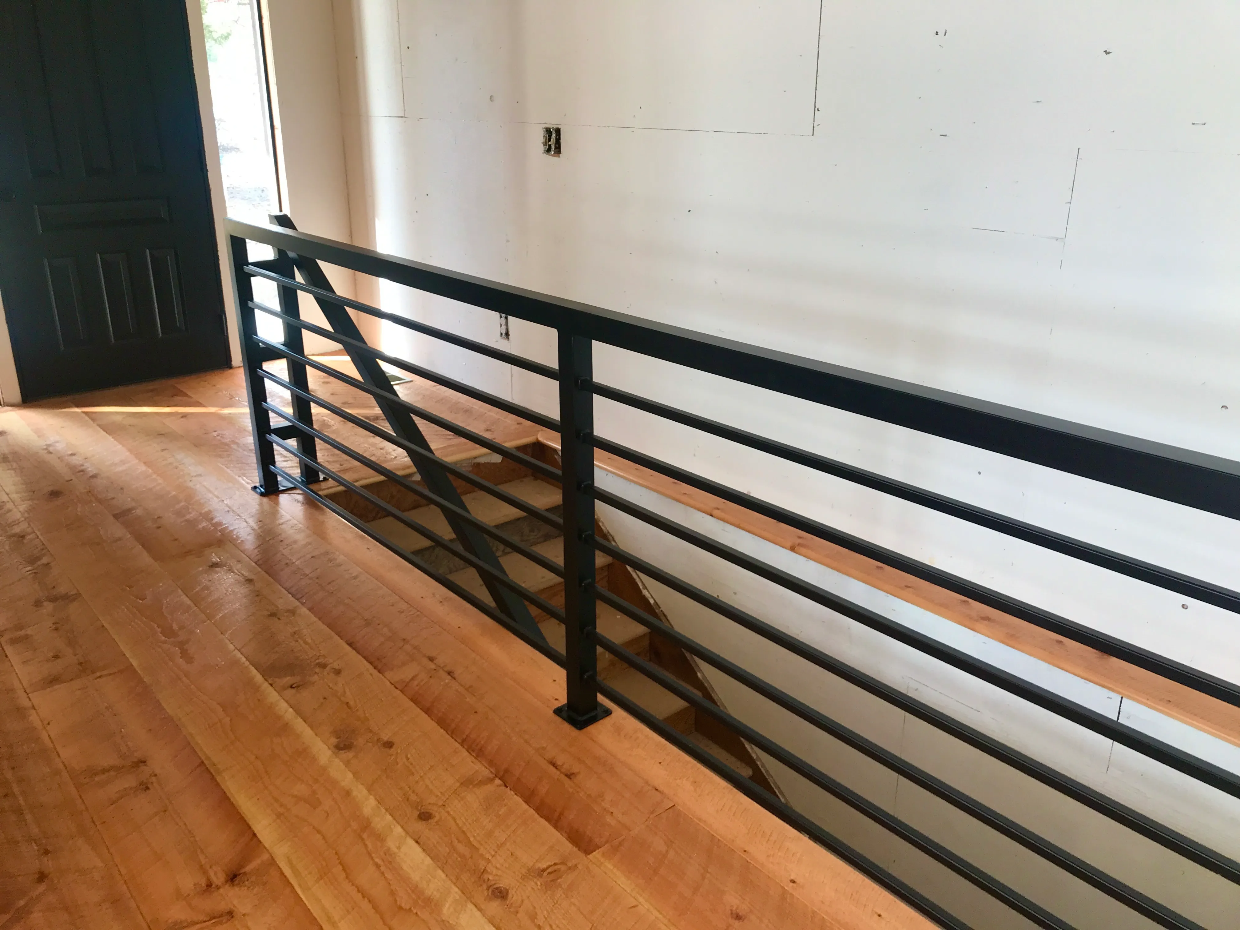 Hand-forged metal railing with artistic design