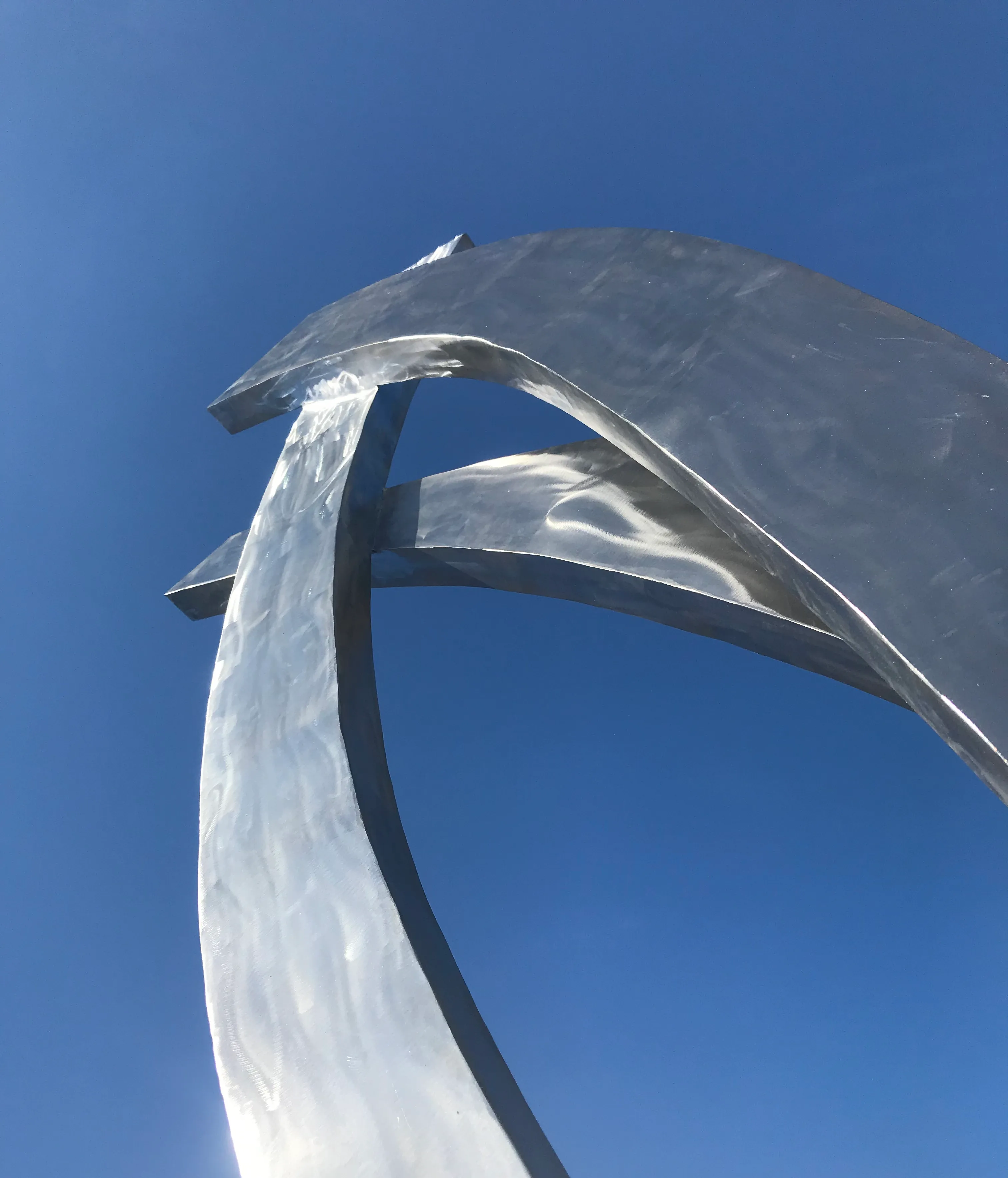 Large metal sculpture with sweeping curves
