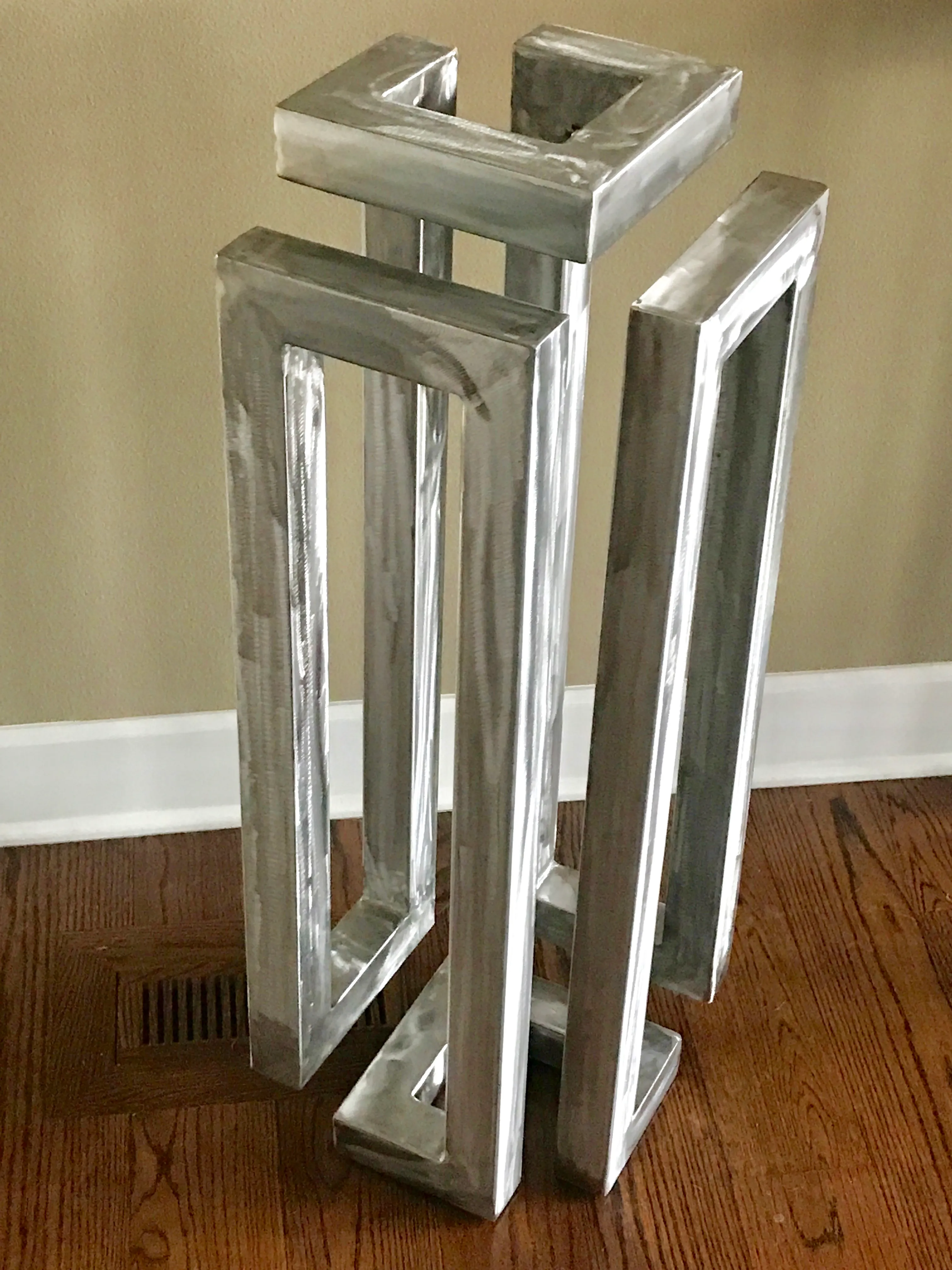 Steel sculpture with textured welded surface