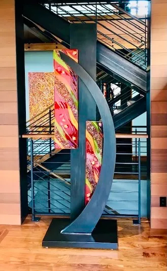 Metal and glass sculpture with Pacific Northwest inspiration