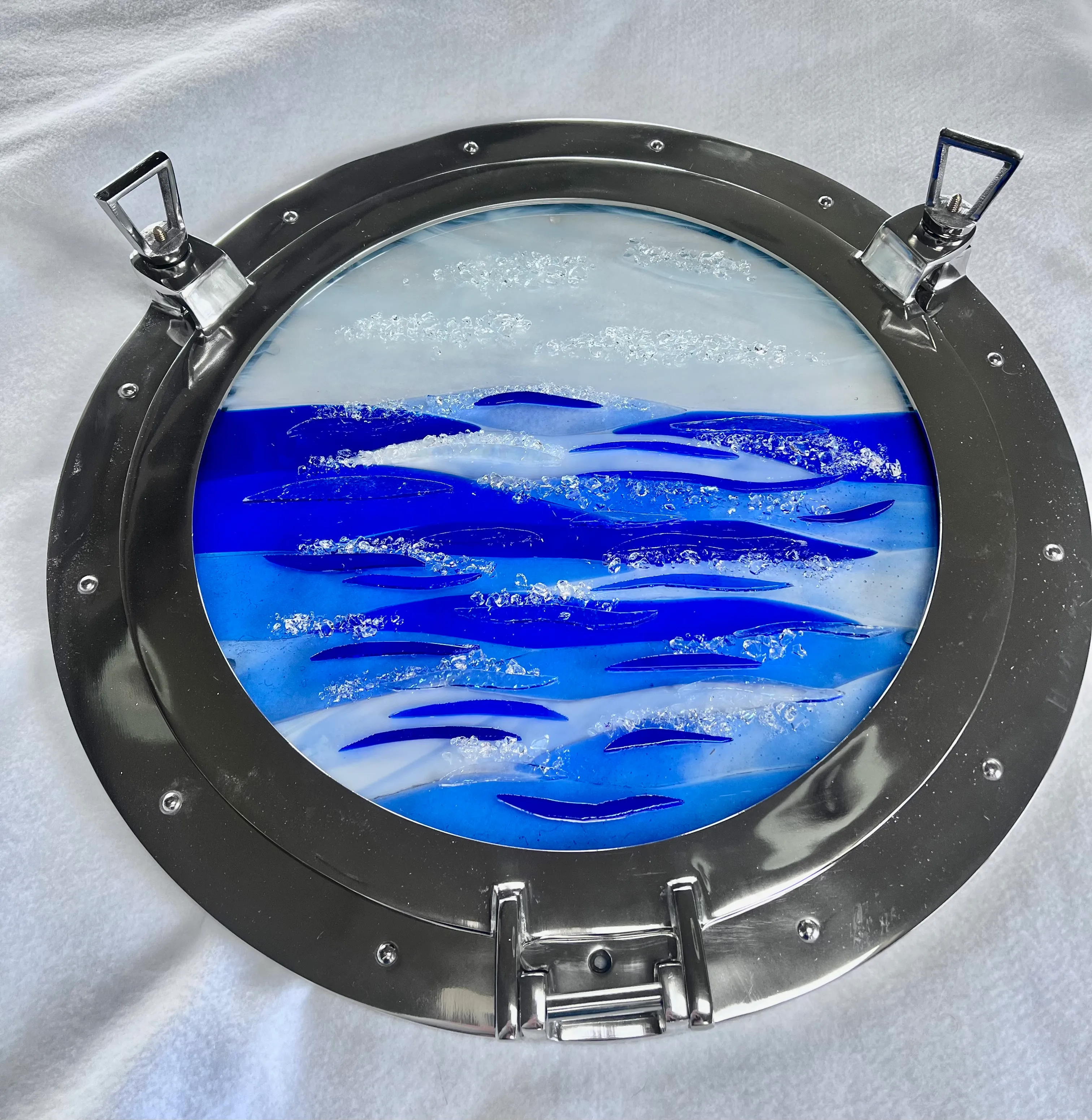 Freestanding metal and glass art piece with rich colors