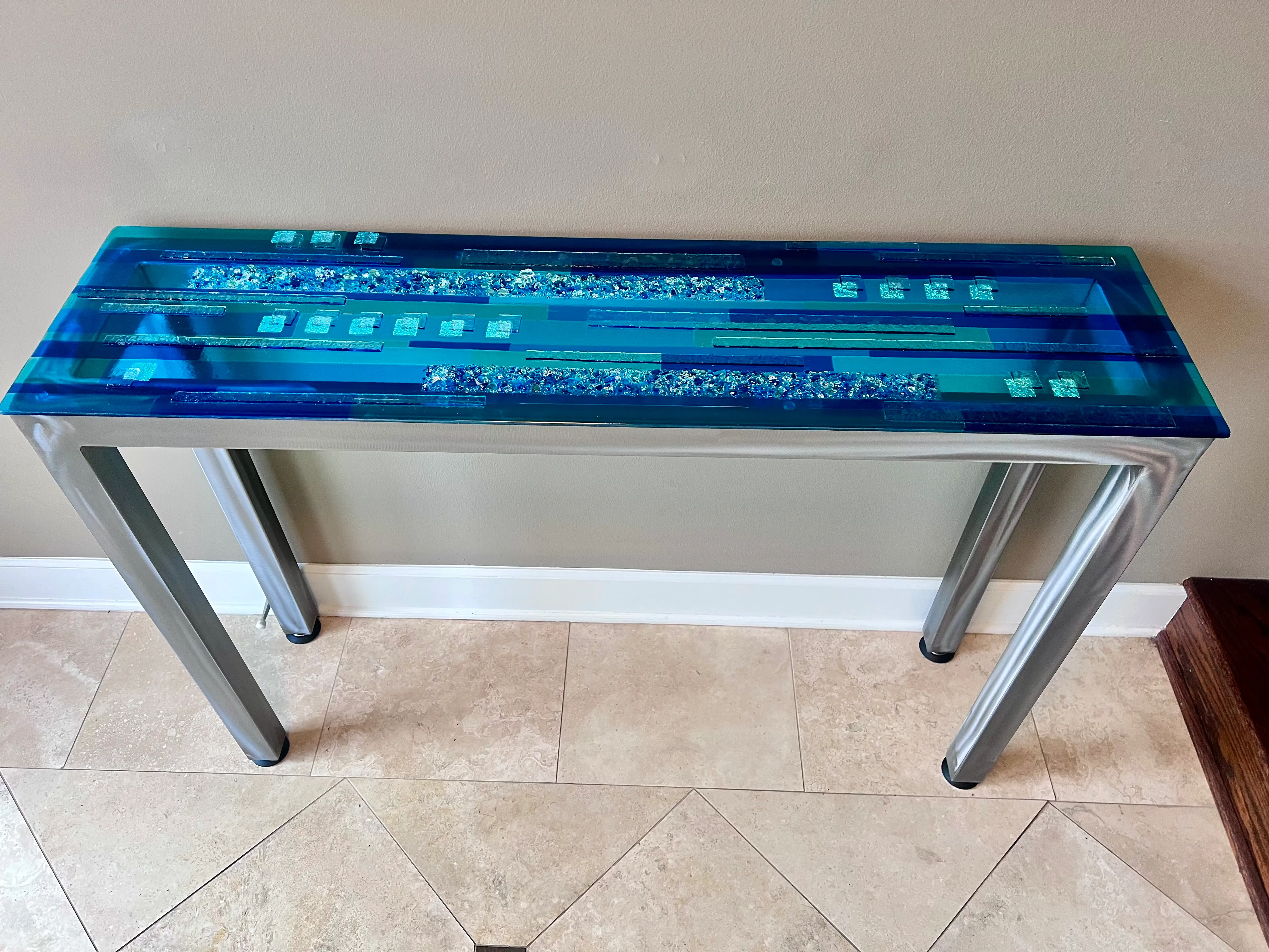 Handcrafted glass table with layered elements