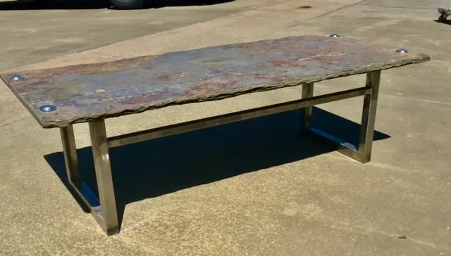 Metal furniture with hand-welded frame